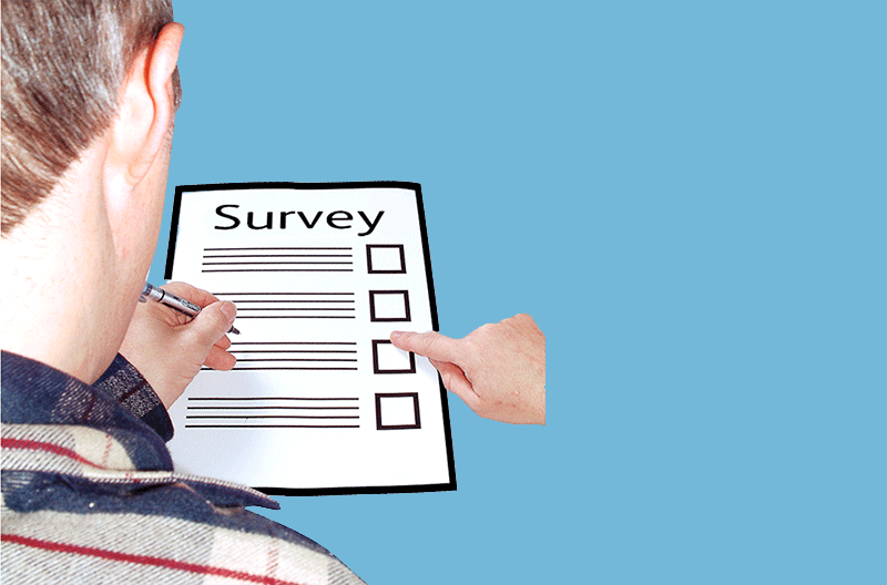 man completing survey