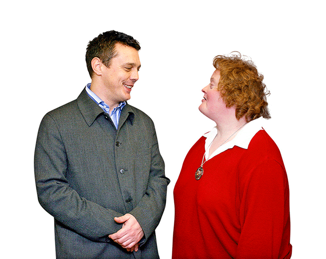 An image of a man and a woman talking