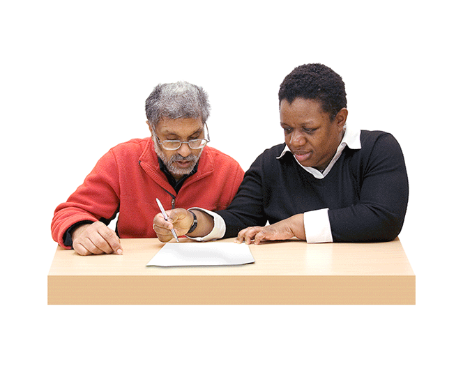 An image of two people writing
