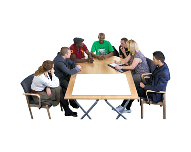 An image of a group of people sat around a table